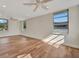 Spacious living room with wood-look floors and ceiling fan at 5411 16Th W St, Bradenton, FL 34207