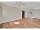 Bright living room featuring hardwood floors and ceiling fan at 5411 16Th W St, Bradenton, FL 34207