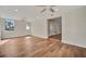 Spacious living room with wood-look floors and ceiling fan at 5411 16Th W St, Bradenton, FL 34207