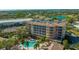 Luxury building with pool and lush landscaping at 5560 Cannes Cir # 3-106, Sarasota, FL 34231