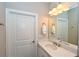 Bright bathroom with vanity, mirror, and modern finishes at 5560 Cannes Cir # 3-106, Sarasota, FL 34231