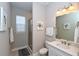 Clean bathroom with a walk-in shower and vanity at 5560 Cannes Cir # 3-106, Sarasota, FL 34231