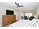 Main bedroom with king-size bed and large dresser at 5560 Cannes Cir # 3-106, Sarasota, FL 34231