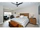 Main bedroom with a king-size bed and seating area at 5560 Cannes Cir # 3-106, Sarasota, FL 34231
