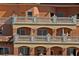 Building with balconies, arched windows and ornate detailing at 5560 Cannes Cir # 3-106, Sarasota, FL 34231