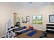 Well-equipped fitness center with weight machines and mats at 5560 Cannes Cir # 3-106, Sarasota, FL 34231