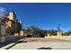 Community entrance with landscaping and building view at 5560 Cannes Cir # 3-106, Sarasota, FL 34231