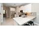 Modern kitchen with white shaker cabinets, stainless steel appliances, and granite counters at 5560 Cannes Cir # 3-106, Sarasota, FL 34231