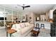 Open living space featuring a sofa, dining table, and kitchen with island at 5560 Cannes Cir # 3-106, Sarasota, FL 34231