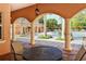 Relaxing pool area with patio furniture and lush landscaping at 5560 Cannes Cir # 3-106, Sarasota, FL 34231