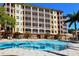 Resort-style pool with surrounding lounge chairs at 5560 Cannes Cir # 3-106, Sarasota, FL 34231