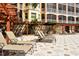Spacious pool deck with comfortable lounge chairs at 5560 Cannes Cir # 3-106, Sarasota, FL 34231