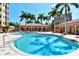 Inviting kidney-shaped pool with plenty of lounge space at 5560 Cannes Cir # 3-106, Sarasota, FL 34231