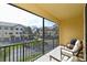 Relaxing screened balcony overlooking community with seating at 5560 Cannes Cir # 3-106, Sarasota, FL 34231