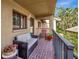 Small condo balcony with seating and tropical views at 5574 Ashton Lake Dr # 5574, Sarasota, FL 34231