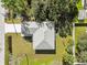 Directly above view of single-story house with gray roof and small yard at 5629 Crenshaw Ln, North Port, FL 34286