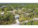 Single-story house in a wooded neighborhood at 5629 Crenshaw Ln, North Port, FL 34286