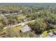 Single-story house in a wooded neighborhood at 5629 Crenshaw Ln, North Port, FL 34286
