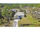 Single-story house with driveway and large yard at 5629 Crenshaw Ln, North Port, FL 34286