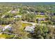 Single-story house in a wooded neighborhood at 5629 Crenshaw Ln, North Port, FL 34286