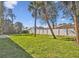 Large backyard with grassy area and privacy fence at 5629 Crenshaw Ln, North Port, FL 34286