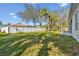 Spacious backyard with grassy area and privacy fence at 5629 Crenshaw Ln, North Port, FL 34286