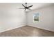 Spacious bedroom with ceiling fan and large window at 5629 Crenshaw Ln, North Port, FL 34286