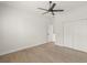 Bright bedroom with ceiling fan and wood-look flooring at 5629 Crenshaw Ln, North Port, FL 34286