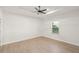 Bright bedroom with ceiling fan and wood-look flooring at 5629 Crenshaw Ln, North Port, FL 34286