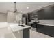 Modern kitchen features stainless steel appliances and a large island at 5629 Crenshaw Ln, North Port, FL 34286