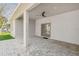 Covered patio with paver stone flooring and ceiling fan at 5629 Crenshaw Ln, North Port, FL 34286