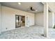 Covered patio with paver stones and access to the interior at 5629 Crenshaw Ln, North Port, FL 34286
