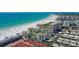 Aerial view of beachfront community and ocean at 6144 Midnight Pass Rd # 2N, Sarasota, FL 34242