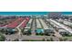 Aerial view of community featuring numerous homes and a pool at 6144 Midnight Pass Rd # 2N, Sarasota, FL 34242