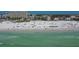 Aerial beach view showing building and beachgoers at 6144 Midnight Pass Rd # 2N, Sarasota, FL 34242