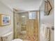 Clean bathroom with granite countertop, modern vanity, and a large mirror at 6144 Midnight Pass Rd # 2N, Sarasota, FL 34242