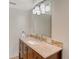 Clean bathroom with granite countertop, modern vanity, and a large mirror at 6144 Midnight Pass Rd # 2N, Sarasota, FL 34242
