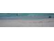 Tranquil beach scene with people enjoying the water at 6144 Midnight Pass Rd # 2N, Sarasota, FL 34242