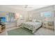 Main bedroom with a king-size bed, dresser and window at 6144 Midnight Pass Rd # 2N, Sarasota, FL 34242