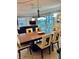 Dining room with a view of the living room and access to the patio at 6144 Midnight Pass Rd # 2N, Sarasota, FL 34242