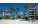 Condo building with lush landscaping and courtyard at 6144 Midnight Pass Rd # 2N, Sarasota, FL 34242