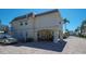 Two-story building exterior with parking and landscaping at 6144 Midnight Pass Rd # 2N, Sarasota, FL 34242