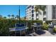 Community grills and seating area near condo building at 6144 Midnight Pass Rd # 2N, Sarasota, FL 34242
