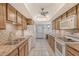 Well-equipped kitchen with granite countertops and wood cabinets at 6144 Midnight Pass Rd # 2N, Sarasota, FL 34242