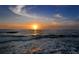 Stunning ocean sunset view with waves gently rolling onto the shore at 6144 Midnight Pass Rd # 2N, Sarasota, FL 34242