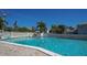 Resort-style pool with ample lounge chairs and patio space at 6144 Midnight Pass Rd # 2N, Sarasota, FL 34242