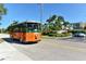 Road scene with trolley and palm trees at 6144 Midnight Pass Rd # 2N, Sarasota, FL 34242