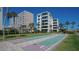 Shuffleboard courts nestled in a tropical condo setting at 6144 Midnight Pass Rd # 2N, Sarasota, FL 34242
