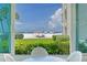 Sunroom with ocean view and seating area at 6144 Midnight Pass Rd # 2N, Sarasota, FL 34242