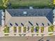 Aerial view of townhome roofs and parking at 6404 Silverstar Dr, Sarasota, FL 34240
